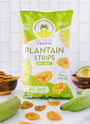 Picture of Artisan Tropic's 10 oz Sea Salt Plantain Strips With Raw Green Plantains and An Avocado in the Background